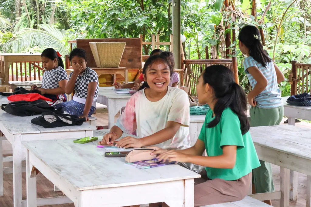 Girls learning together at the PKP Community Centre